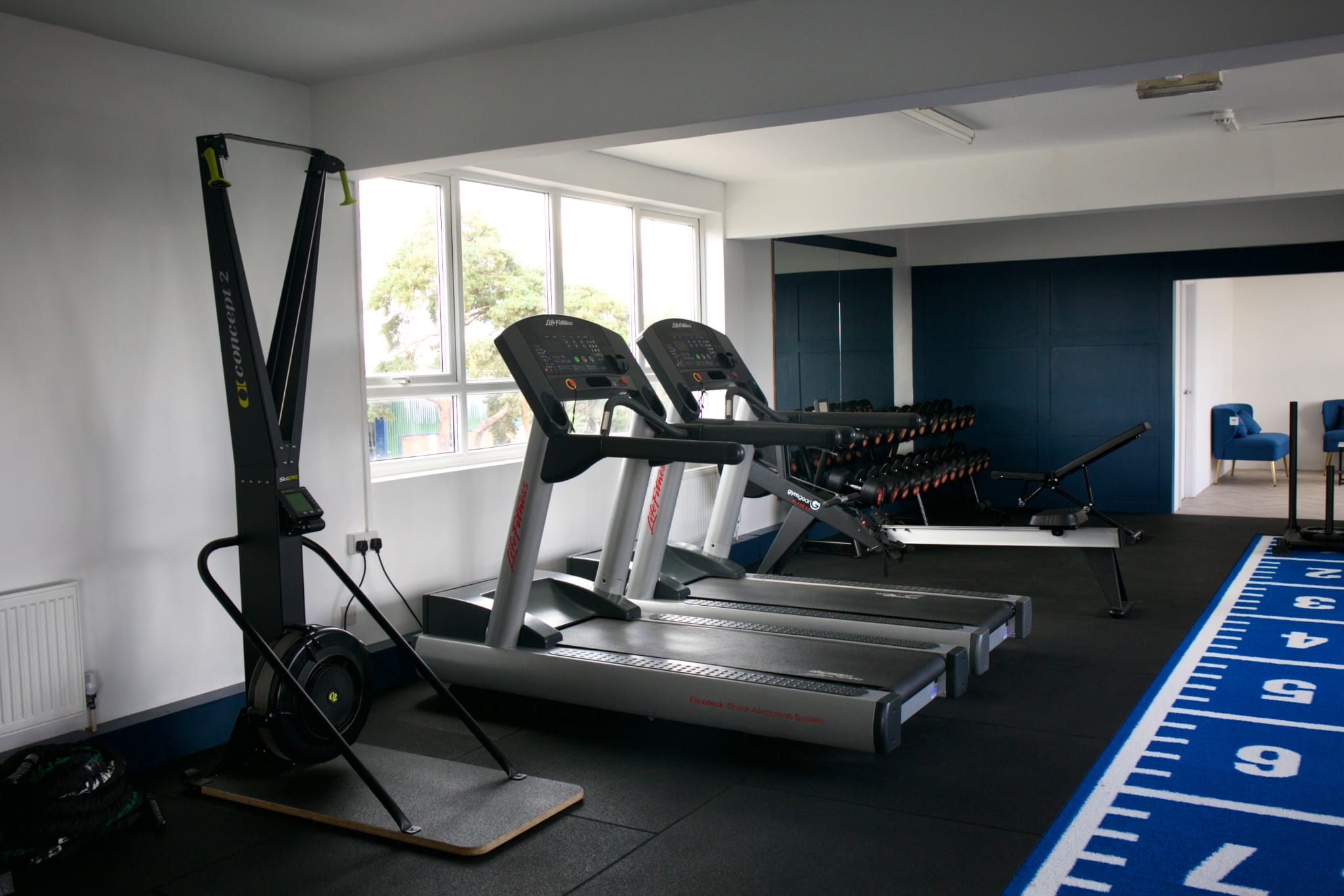 Cardio and conditioning equipment at Top Floor Performance